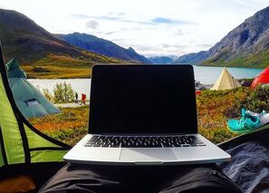 Laptop with view of lake in background
